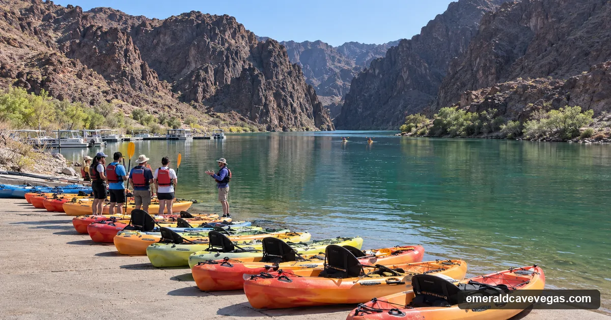 Kayaks lined up on the Willow Beach launch ramp with a guide briefing a group, Black Canyon upstream