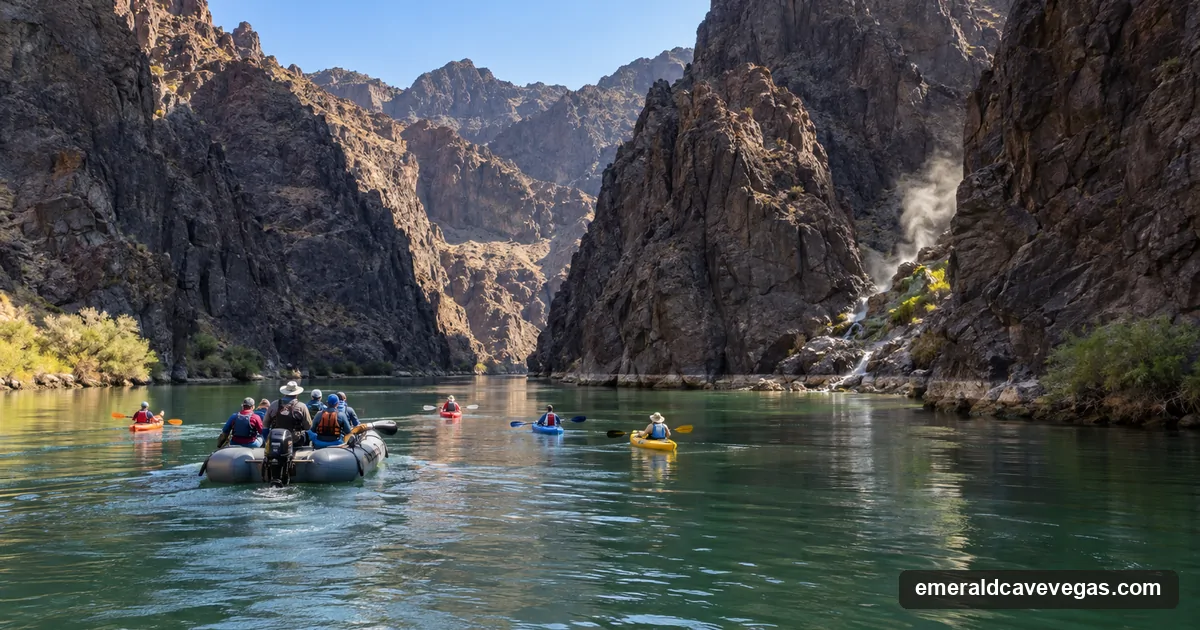 A raft and kayaks drifting down the calm Colorado River through Black Canyon, with a steaming hot-spring side canyon