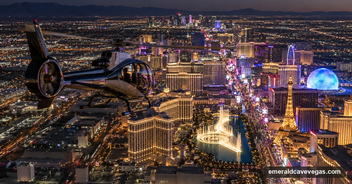 A sightseeing helicopter over the Las Vegas Strip at night with the lit resort corridor below